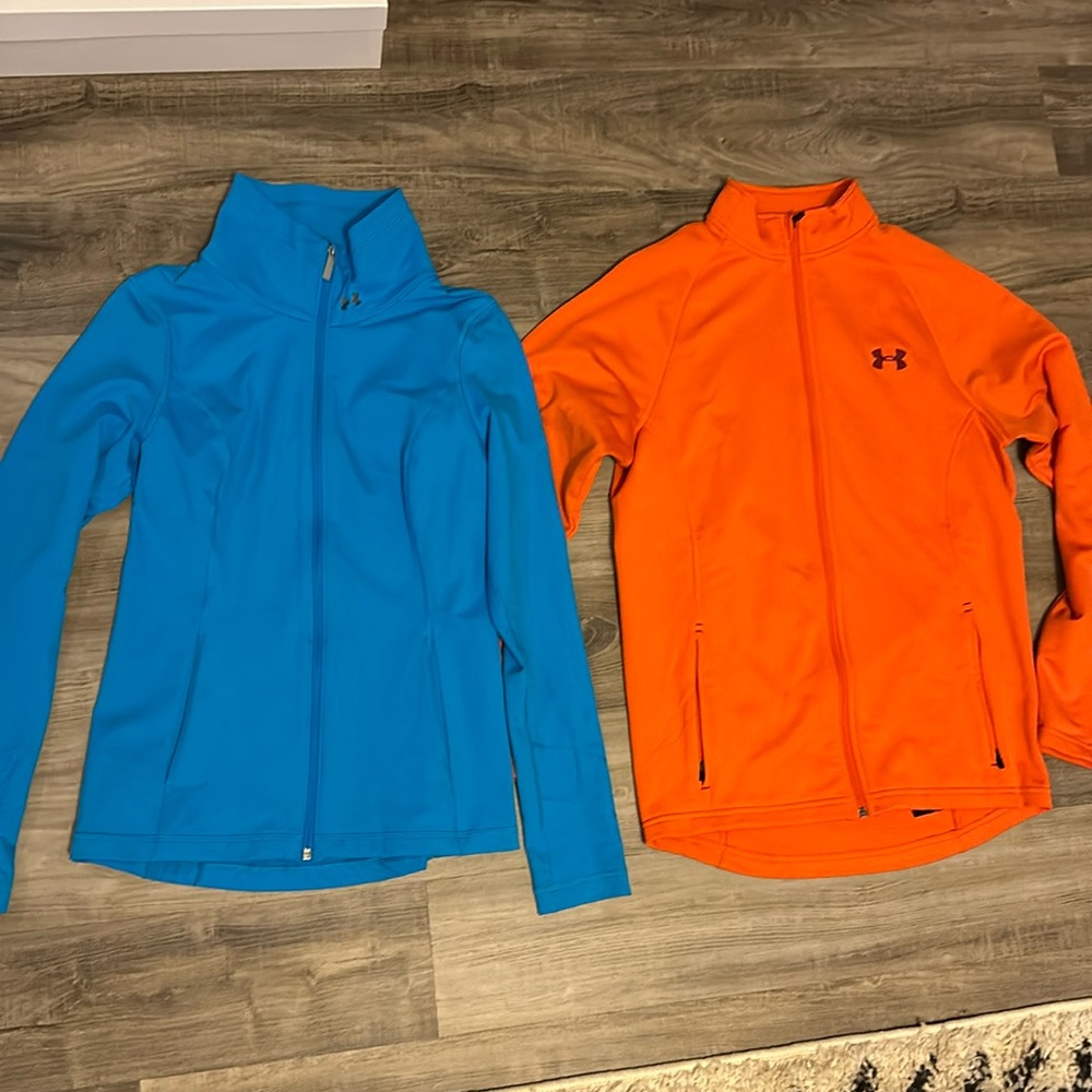 Under Armour Full zips. Blue and orange.SM & Med